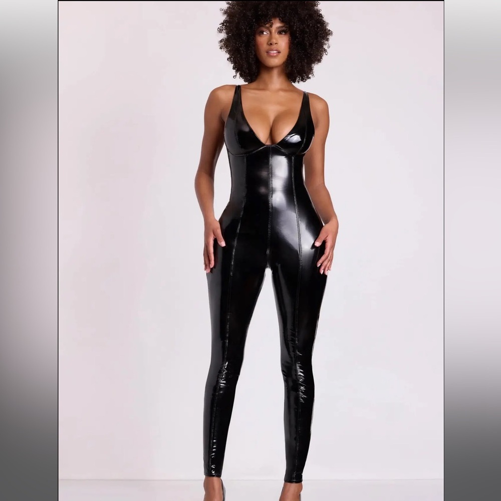 Never been worn still in the bag oh Polly Sleek Black Jumpsuit.